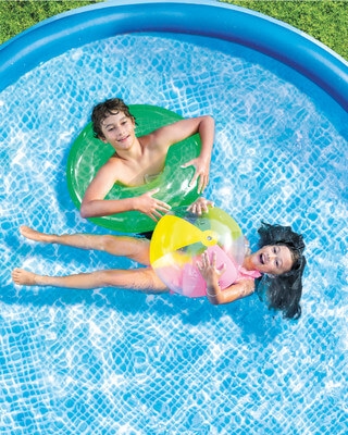 Children playing with inflatable toys